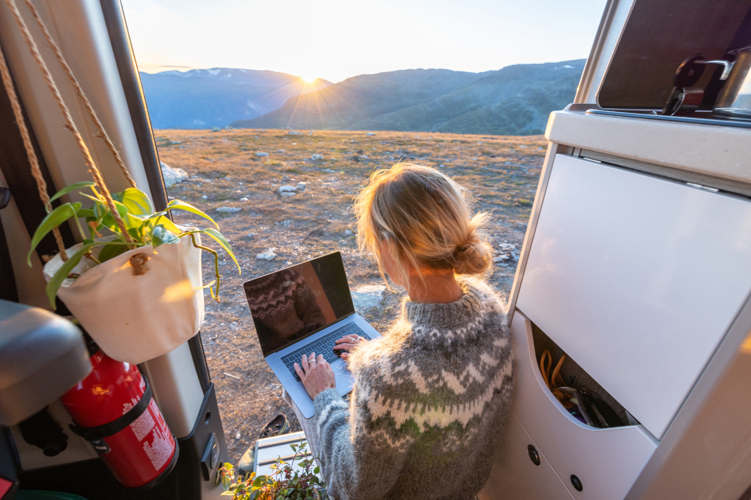 Woman working remotely, van life concept Woman working remotely, van life concept